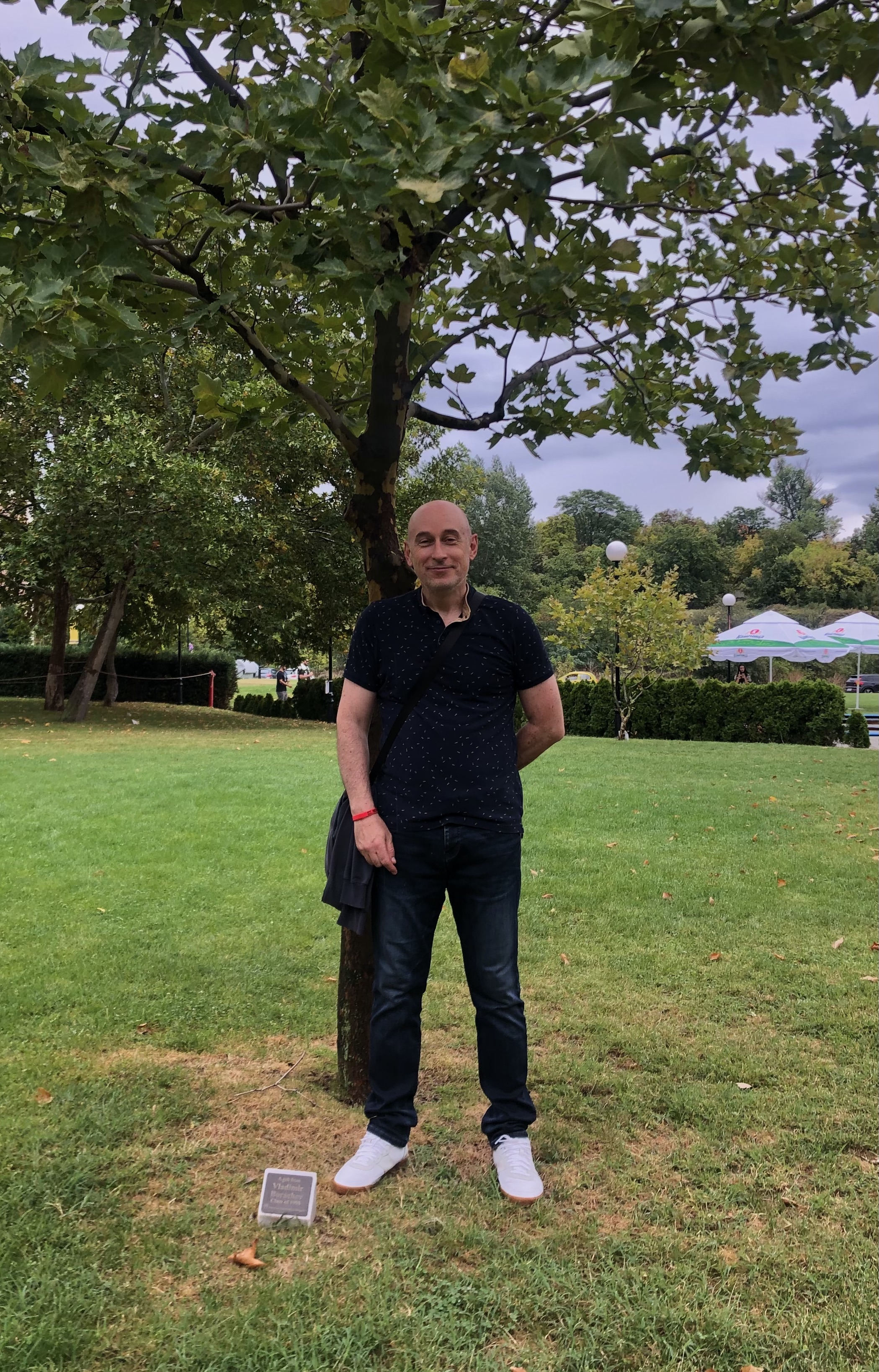 Vladimir Borachev next to a tree he planted in 1995. Photo by Darya Dolgopolova.