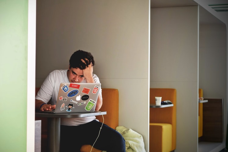 A student studying at a coffee shop. Photo derived from https://unsplash.com/