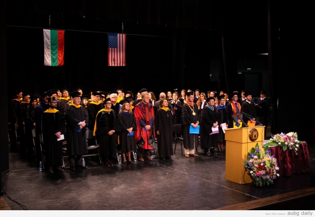 Faculty and students rise during the AUBG Choir performance; Steliyana Yordanova for AUBG Daily